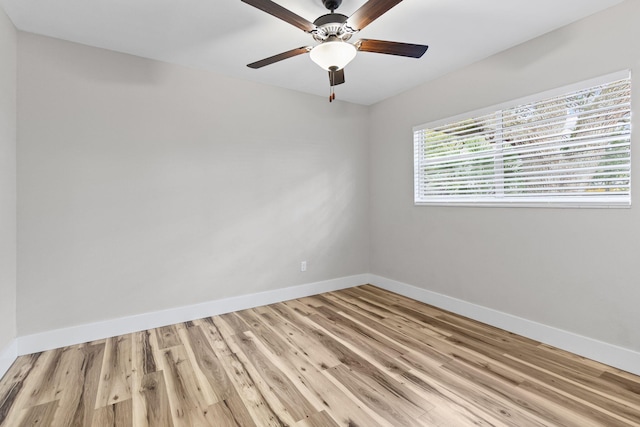 empty room with ceiling fan and light wood-type flooring