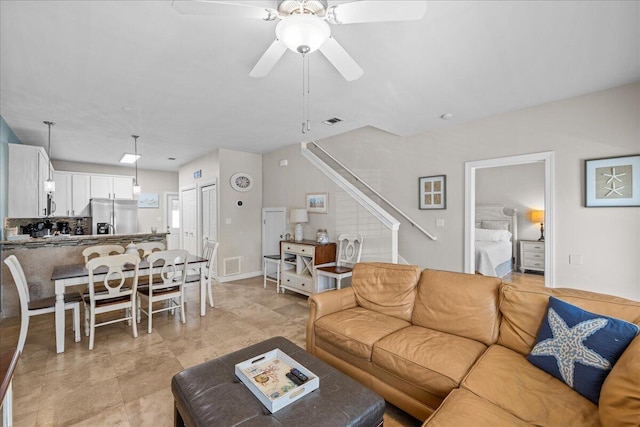 living room with ceiling fan