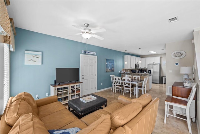 living room with ceiling fan