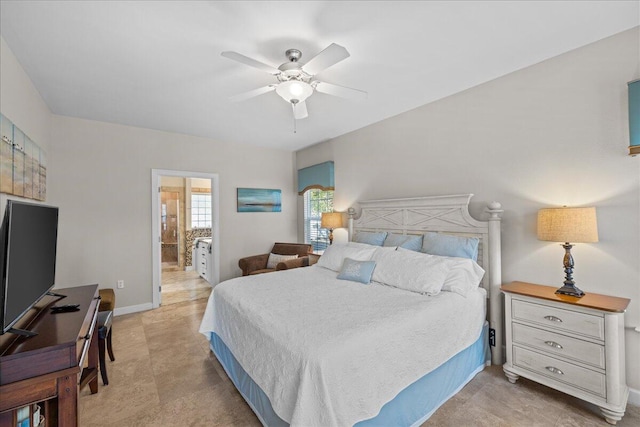 bedroom featuring ceiling fan and ensuite bath