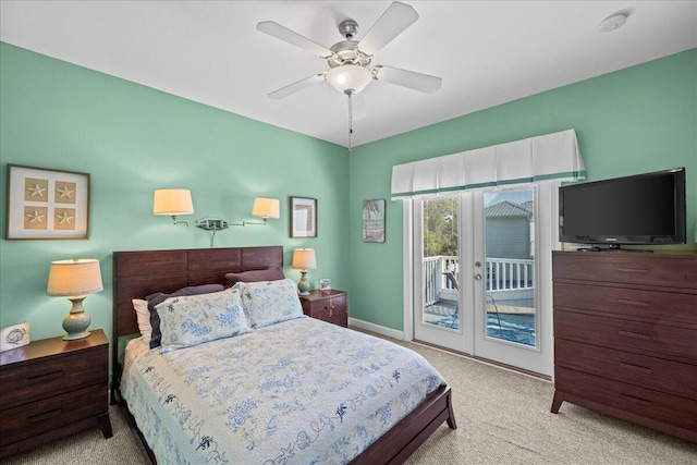 bedroom featuring light carpet, ceiling fan, french doors, and access to outside