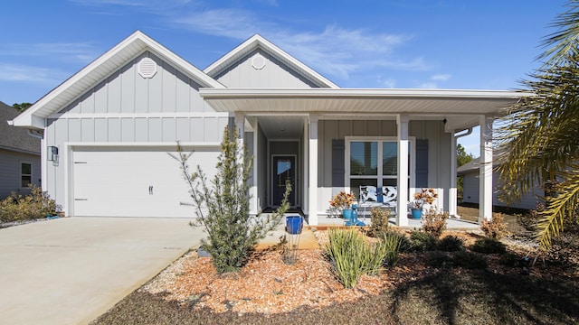 view of front facade with a garage and covered porch