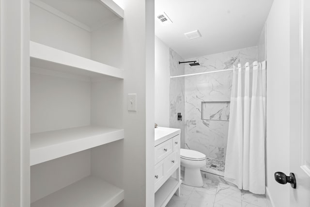 bathroom with vanity, toilet, and walk in shower