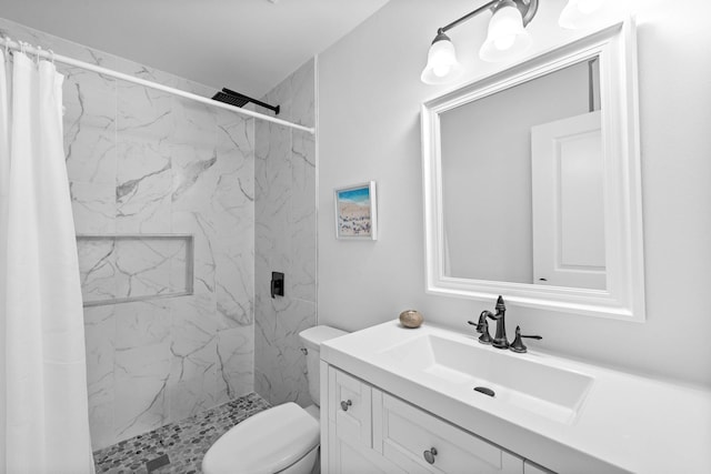 bathroom featuring walk in shower, vanity, and toilet