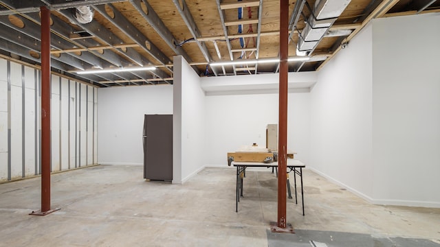 basement featuring black fridge