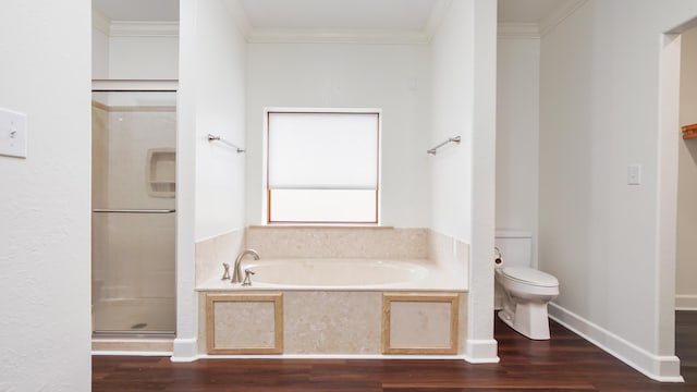 bathroom featuring hardwood / wood-style flooring, ornamental molding, toilet, and separate shower and tub