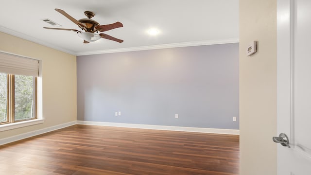 empty room with ornamental molding, ceiling fan, and dark hardwood / wood-style flooring