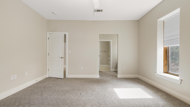 unfurnished bedroom with light carpet