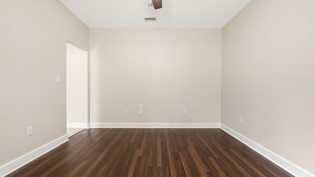 unfurnished room featuring dark hardwood / wood-style floors and ceiling fan