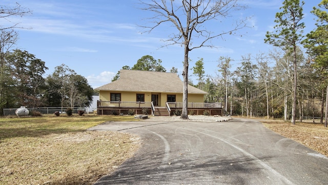 view of front of house with a wooden deck