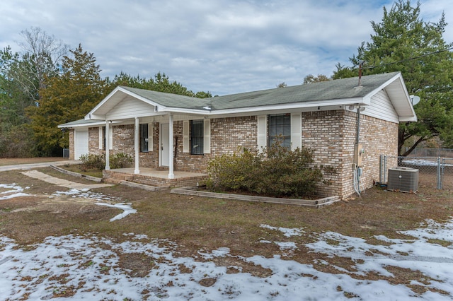 view of front of property featuring central AC unit and covered porch