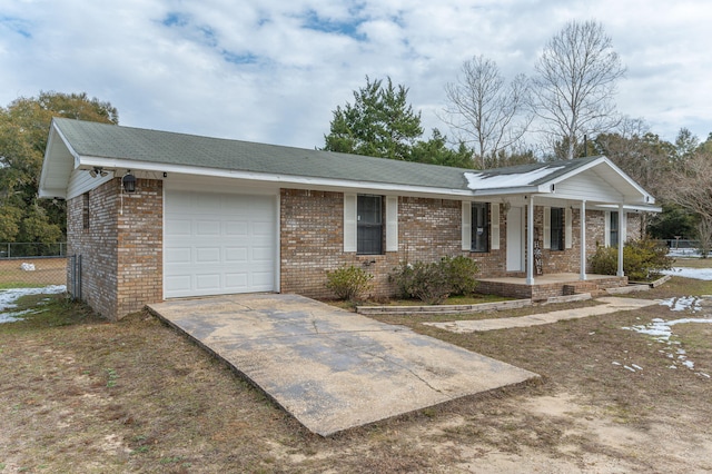 ranch-style house with a garage and a porch