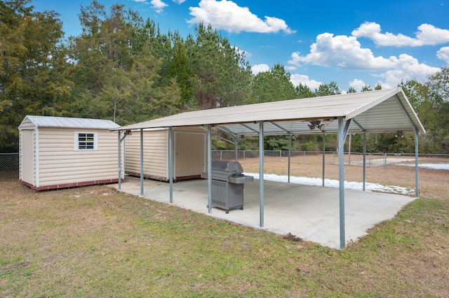 view of parking / parking lot with a carport and a yard