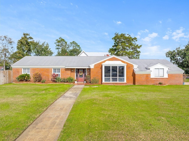 ranch-style home with a front lawn