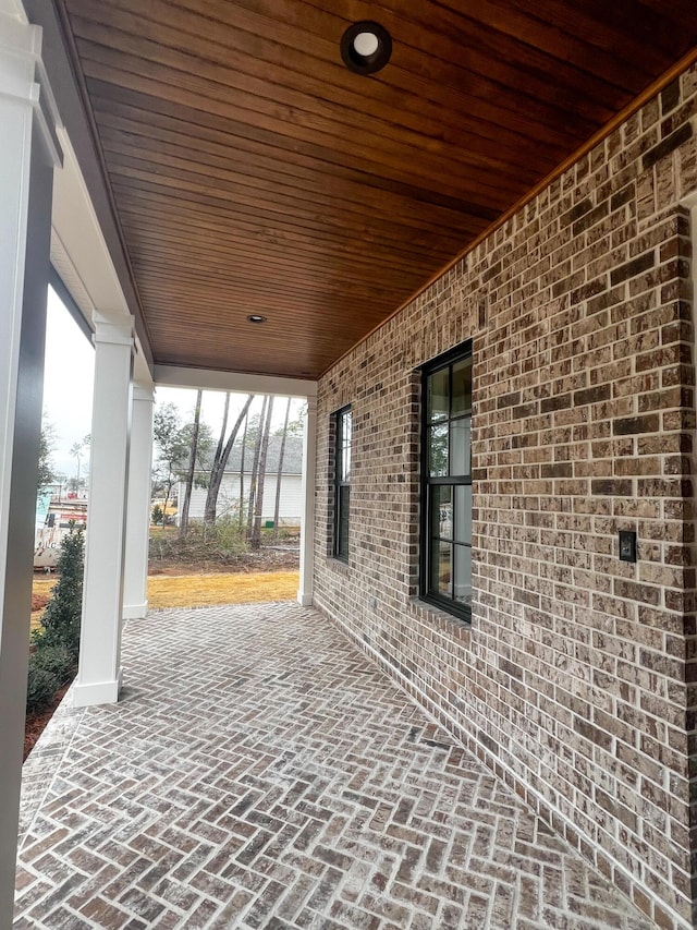 view of patio with a water view