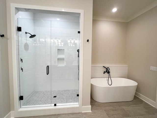 bathroom featuring crown molding, separate shower and tub, and tile patterned flooring