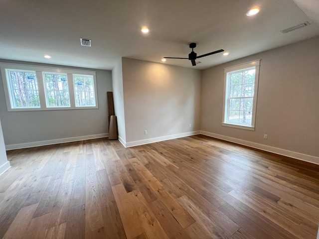 empty room featuring ceiling fan and wood-type flooring