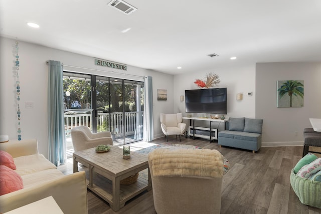 living room with dark hardwood / wood-style floors