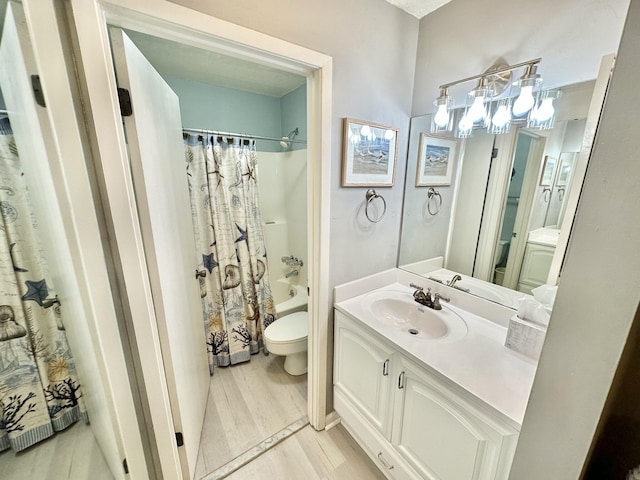 full bathroom featuring toilet, shower / bathtub combination with curtain, hardwood / wood-style floors, and vanity