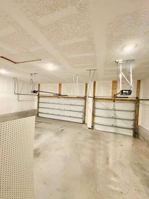 8177 Majestic Cypress Dr, Milton, FL 32583 - garage with a garage door opener