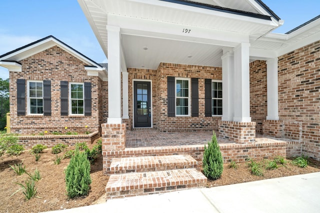 property entrance with covered porch