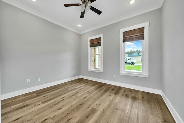 empty room featuring ceiling fan, light hardwood / wood-style flooring, and crown molding