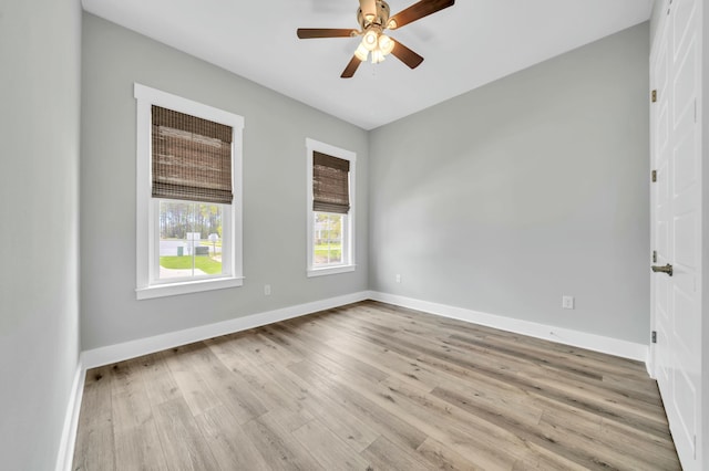 empty room with light wood-type flooring and ceiling fan