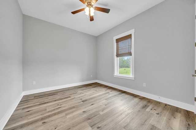 empty room featuring ceiling fan and light hardwood / wood-style floors