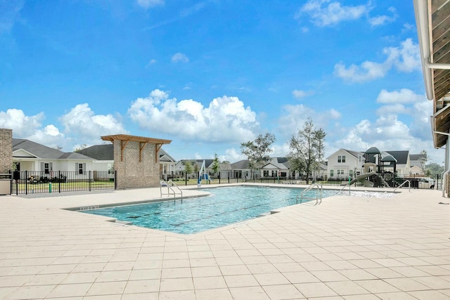 view of swimming pool featuring a patio area