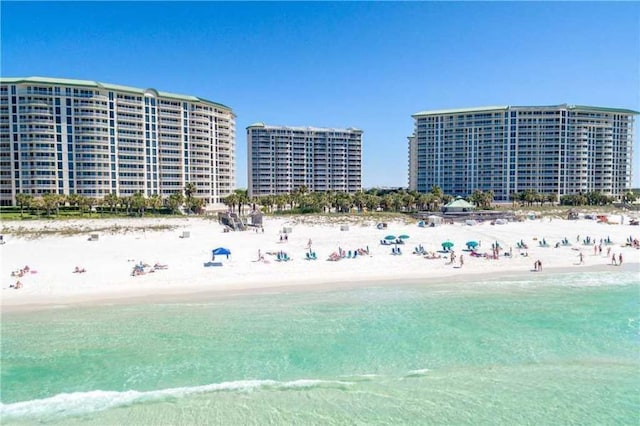 bird's eye view with a water view and a view of the beach