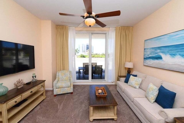 carpeted living room with ceiling fan