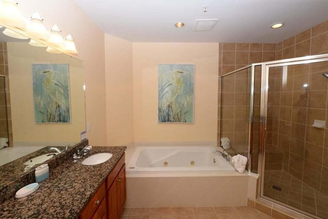 bathroom featuring vanity, independent shower and bath, and tile patterned flooring