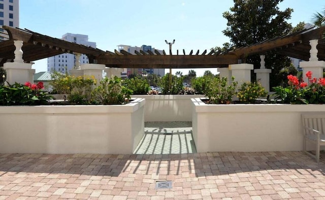 view of patio featuring a pergola