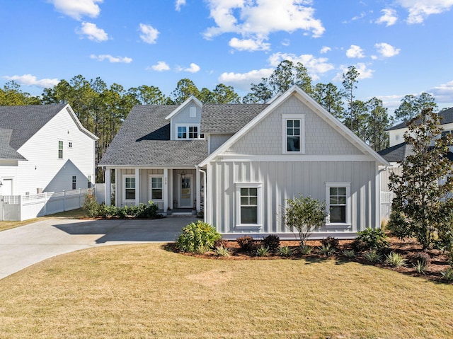 view of front of property with covered porch and a front yard