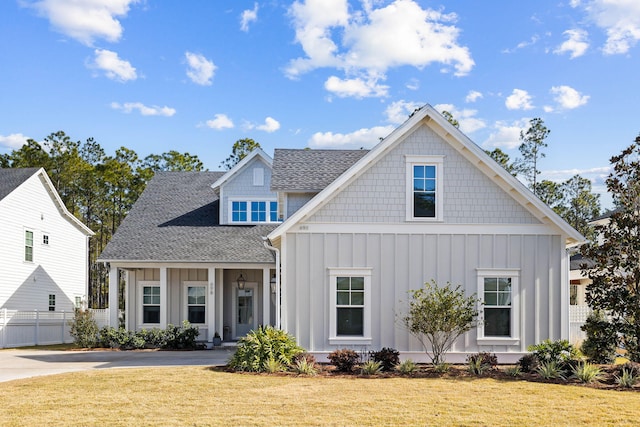 view of front of home featuring a front yard and a porch