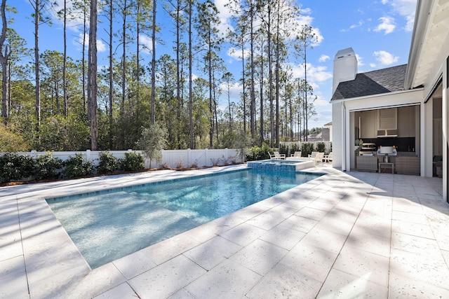 view of pool featuring an in ground hot tub and a patio area