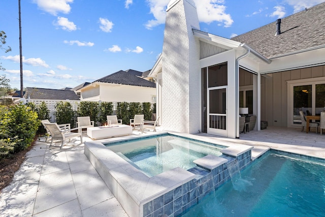 view of swimming pool with an in ground hot tub and a patio