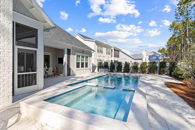 view of swimming pool featuring a patio