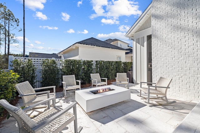 view of patio with an outdoor fire pit