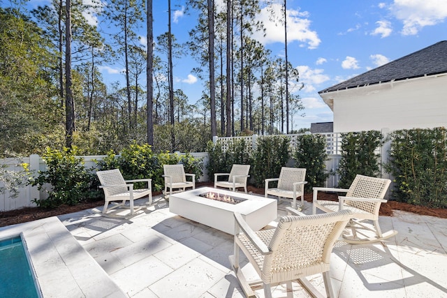 view of patio featuring a fire pit