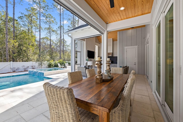 sunroom with wooden ceiling and a healthy amount of sunlight