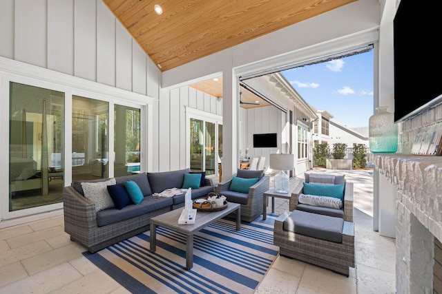 sunroom / solarium with wooden ceiling and vaulted ceiling