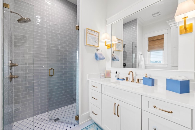 bathroom with ornamental molding, walk in shower, and vanity