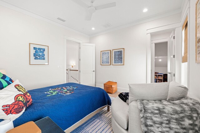 bedroom with ceiling fan, wood-type flooring, and ornamental molding