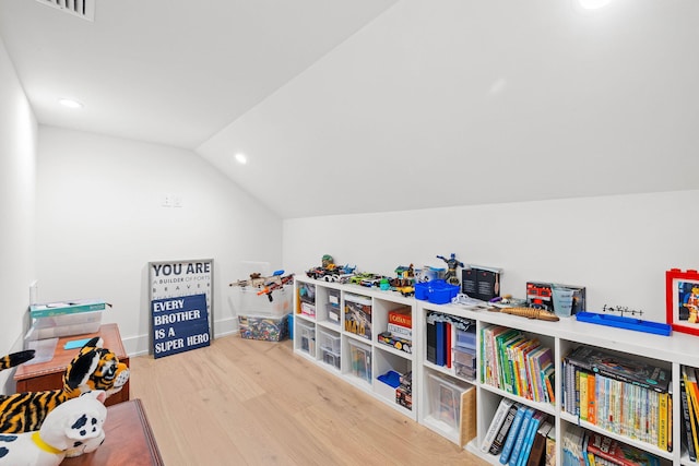 game room featuring vaulted ceiling and wood-type flooring