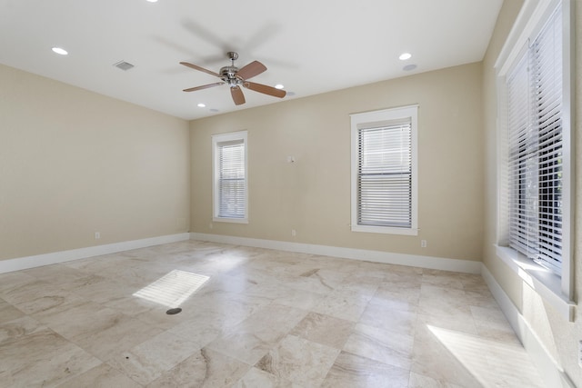 unfurnished room with ceiling fan