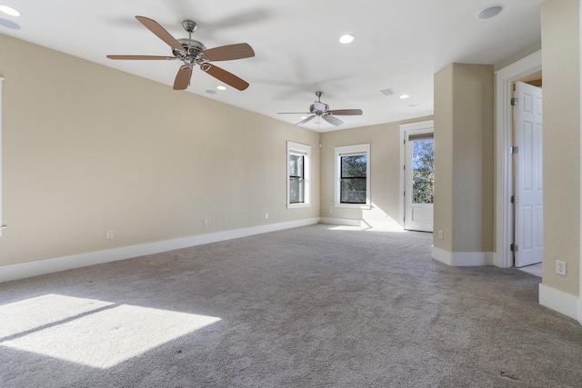 unfurnished living room with ceiling fan and light carpet