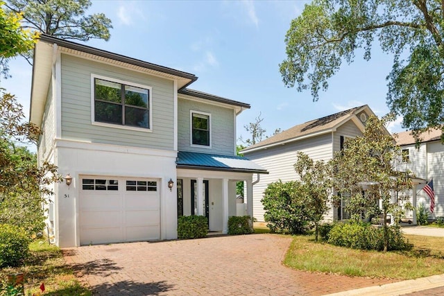 31 Beacon Point Dr, Santa Rosa Beach, FL 32459 - view of front of house featuring an attached garage, decorative driveway, and covered porch