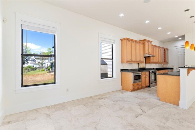 31 Beacon Point Dr, Santa Rosa Beach, FL 32459 - kitchen with appliances with stainless steel finishes, under cabinet range hood, a kitchen bar, decorative light fixtures, and recessed lighting