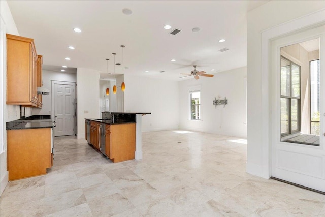 31 Beacon Point Dr, Santa Rosa Beach, FL 32459 - kitchen with brown cabinetry, recessed lighting, a ceiling fan, under cabinet range hood, and open floor plan